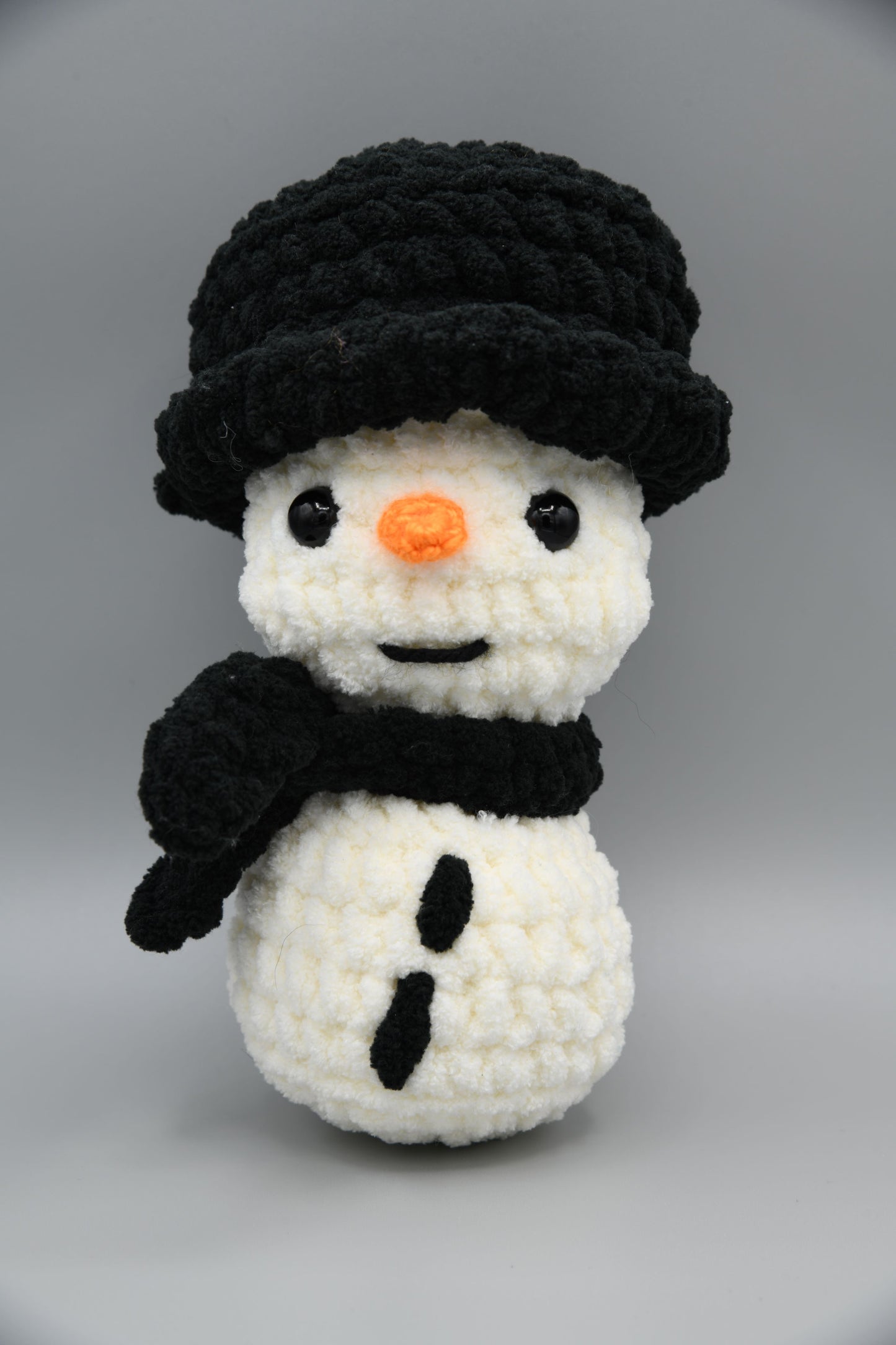 Snowman with black hat and scarf