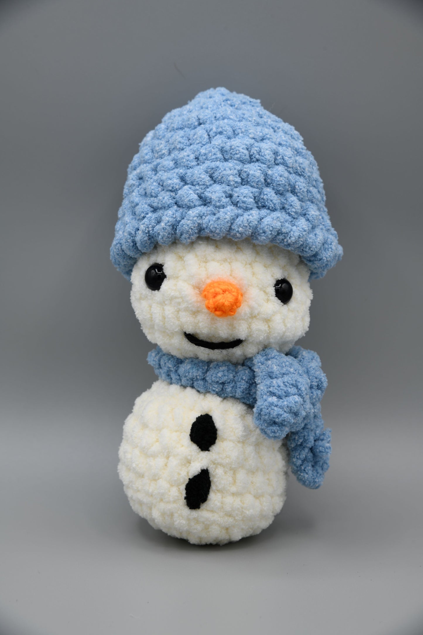 Snowman with blue hat and scarf